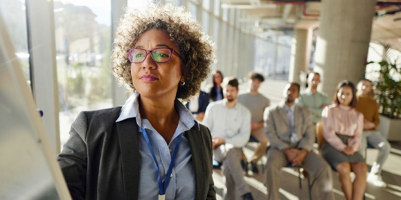 business woman presenting to colleagues