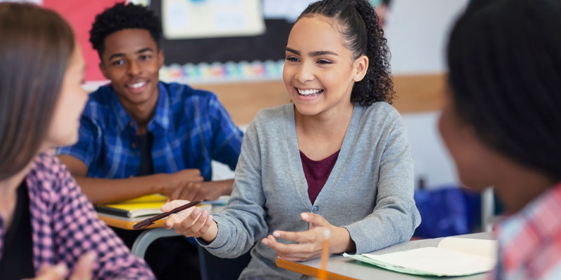 Diverse Middle School students in classroom discussion